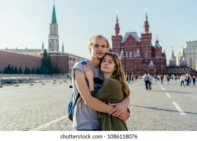young-couple-on-red-square-260nw-1086118076-1705747532.webp